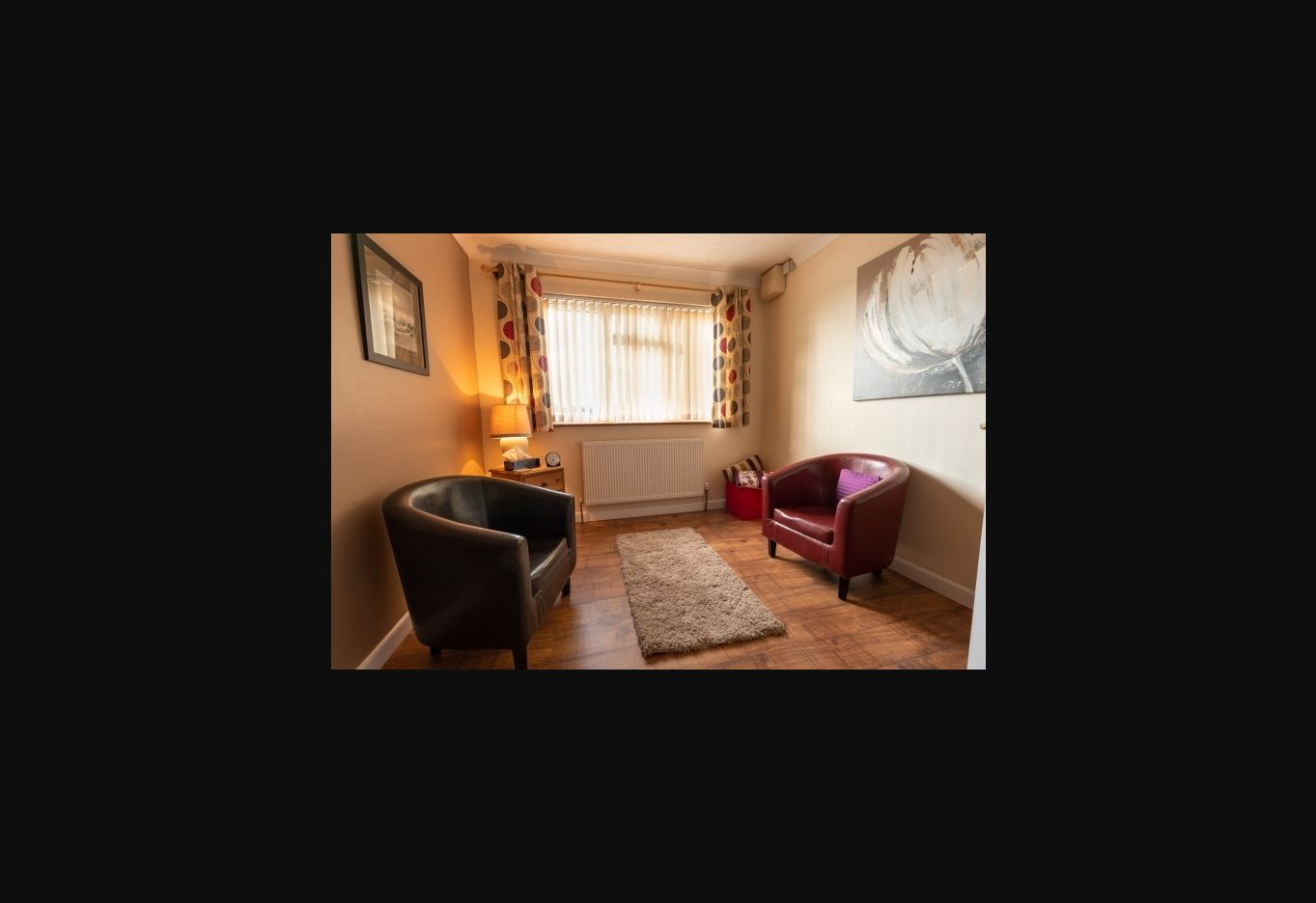 Debbie’s counselling room in Yeovil, with two armchairs and natural light